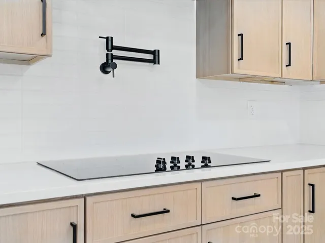 a kitchen with white cabinets