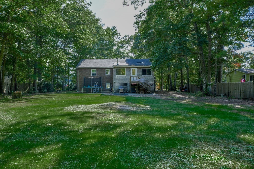 63 Papermill Road Wareham, MA 02576 - Photo 5 of 42 a front view of house with yard and green space