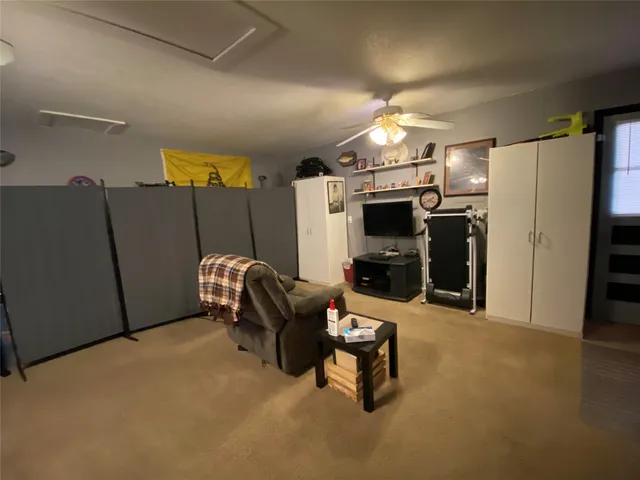 a bedroom with a bed and a tv