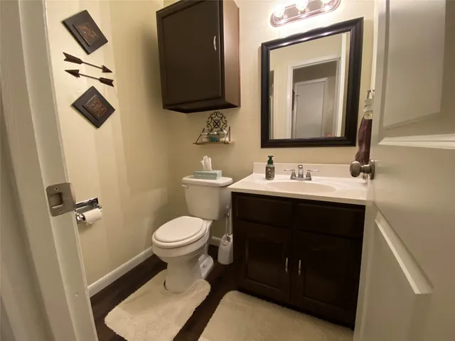 a view of a patio with a table and chairs next to a yard