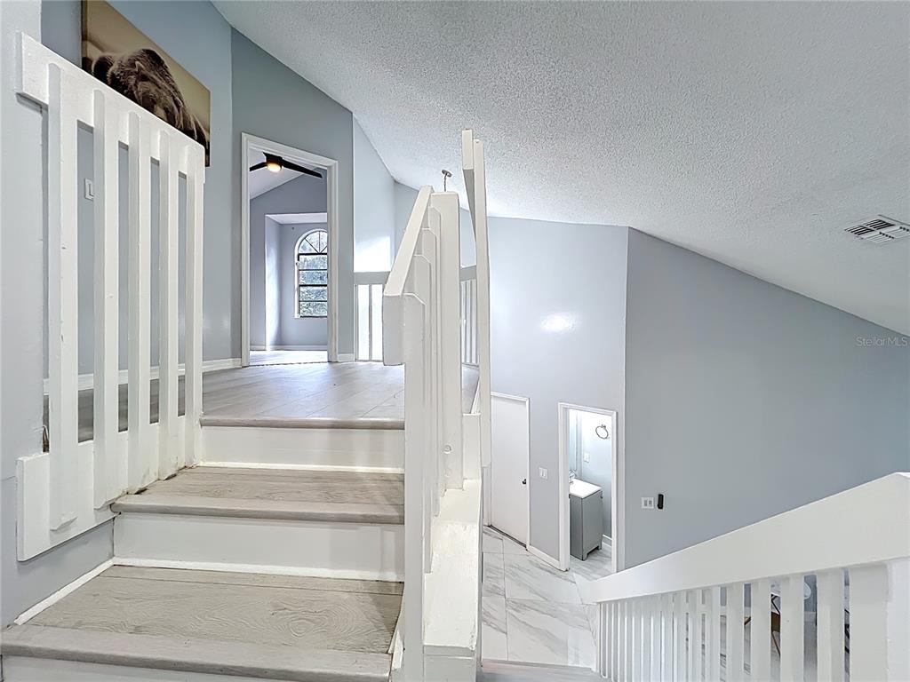 622 Anhinga Road Winter Springs, FL 32708 - Photo 27 of 53 a view of a hallway with wooden floor and entryway