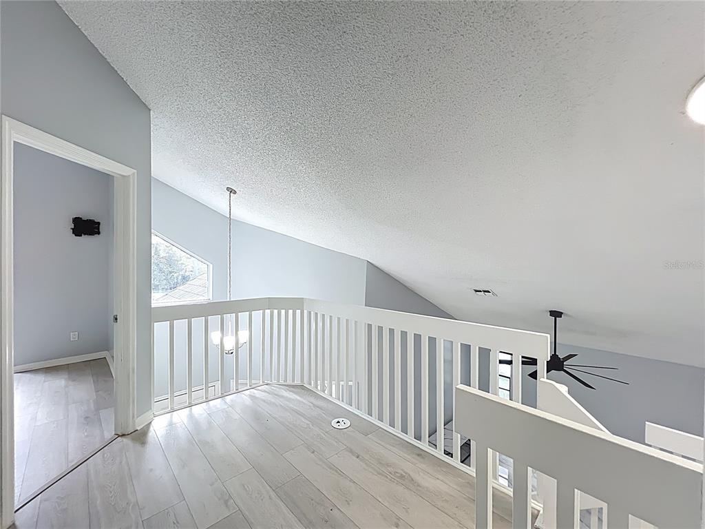 622 Anhinga Road Winter Springs, FL 32708 - Photo 30 of 53 a view of a balcony with wooden floor