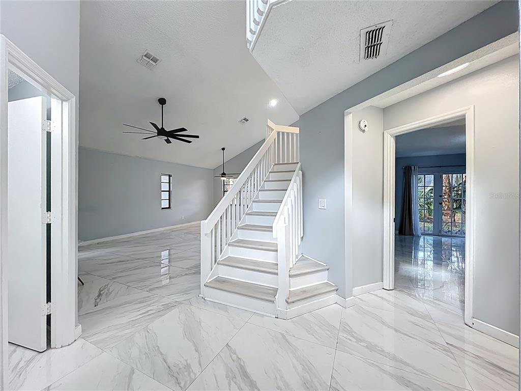 622 Anhinga Road Winter Springs, FL 32708 - Photo 3 of 53 a view of a hallway view with staircase