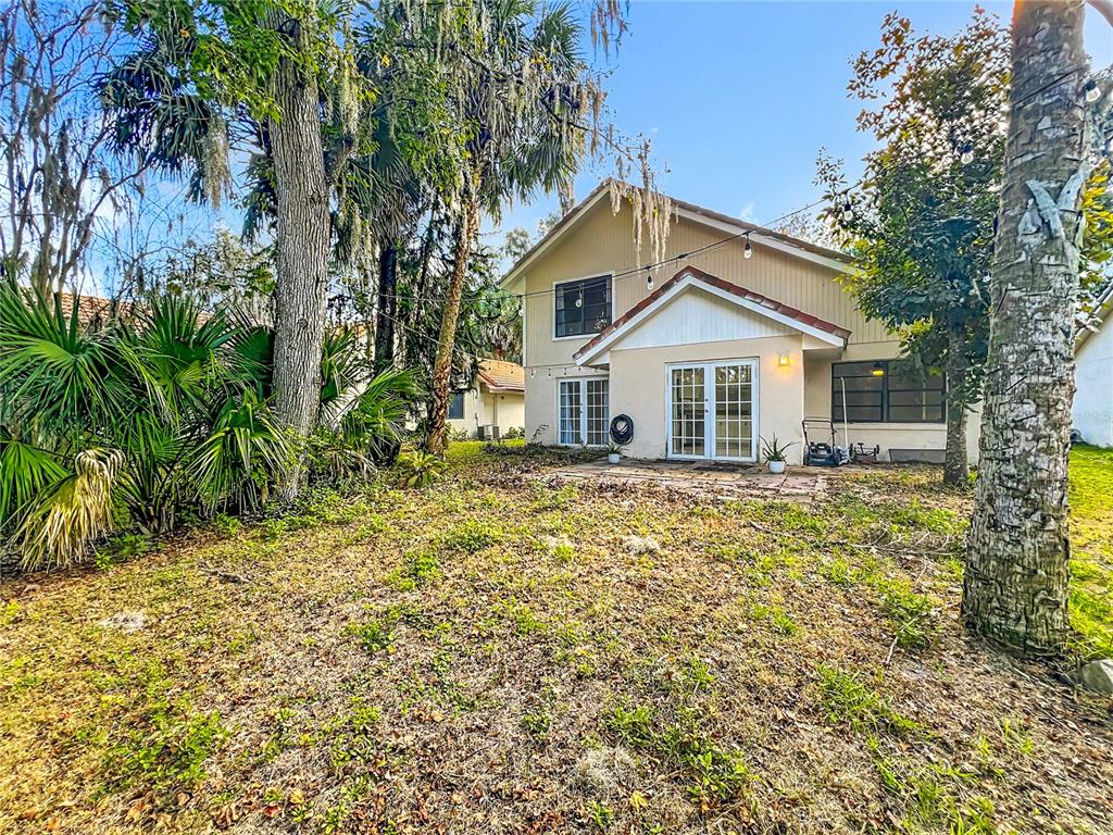 622 Anhinga Road Winter Springs, FL 32708 - Photo 37 of 53 a house with trees in the background
