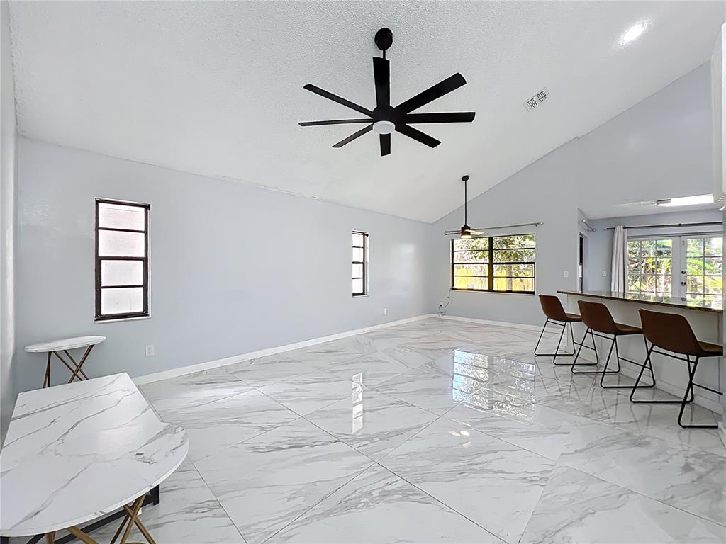 622 Anhinga Road Winter Springs, FL 32708 - Photo 4 of 53 a living room with furniture and a window