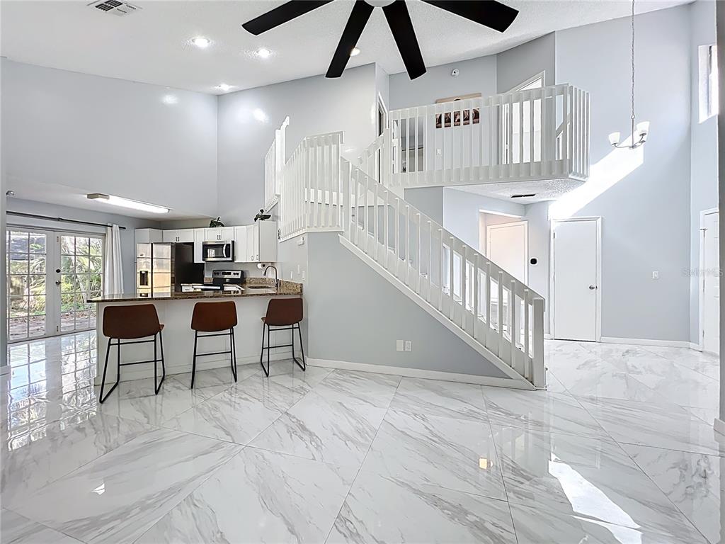 622 Anhinga Road Winter Springs, FL 32708 - Photo 8 of 53 a living room with lots of furniture and white walls