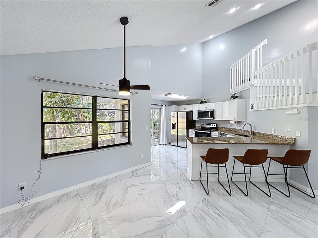 622 Anhinga Road Winter Springs, FL 32708 - Photo 9 of 53 a dining room with furniture and window