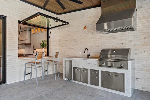 a living room with furniture a flat screen tv and a large window