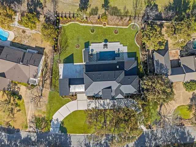 an aerial view of a house with swimming pool