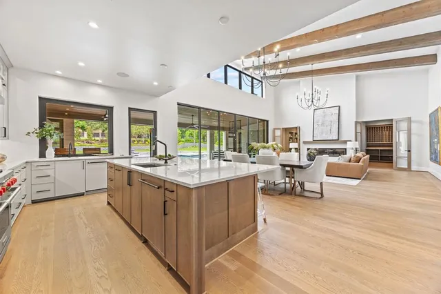 a spacious bedroom with a large bed and a window