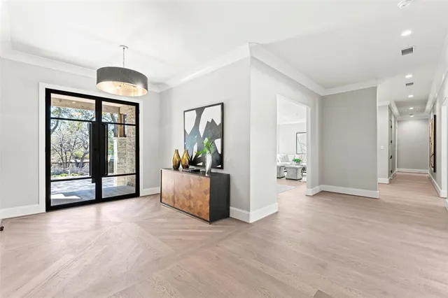 a living room with furniture and large window