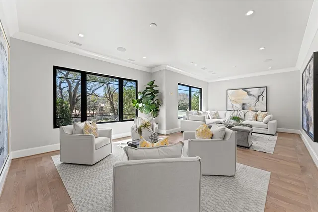 a living room with furniture wooden floor and a fireplace
