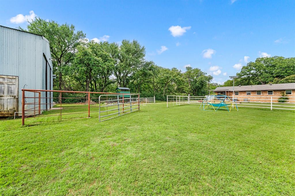 3900 Moseley Road Cross Roads, TX 76227 - Photo 26 of 36 Expansive green lawn with a white perimeter fence