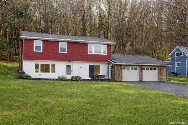 a living room with furniture window and a fireplace