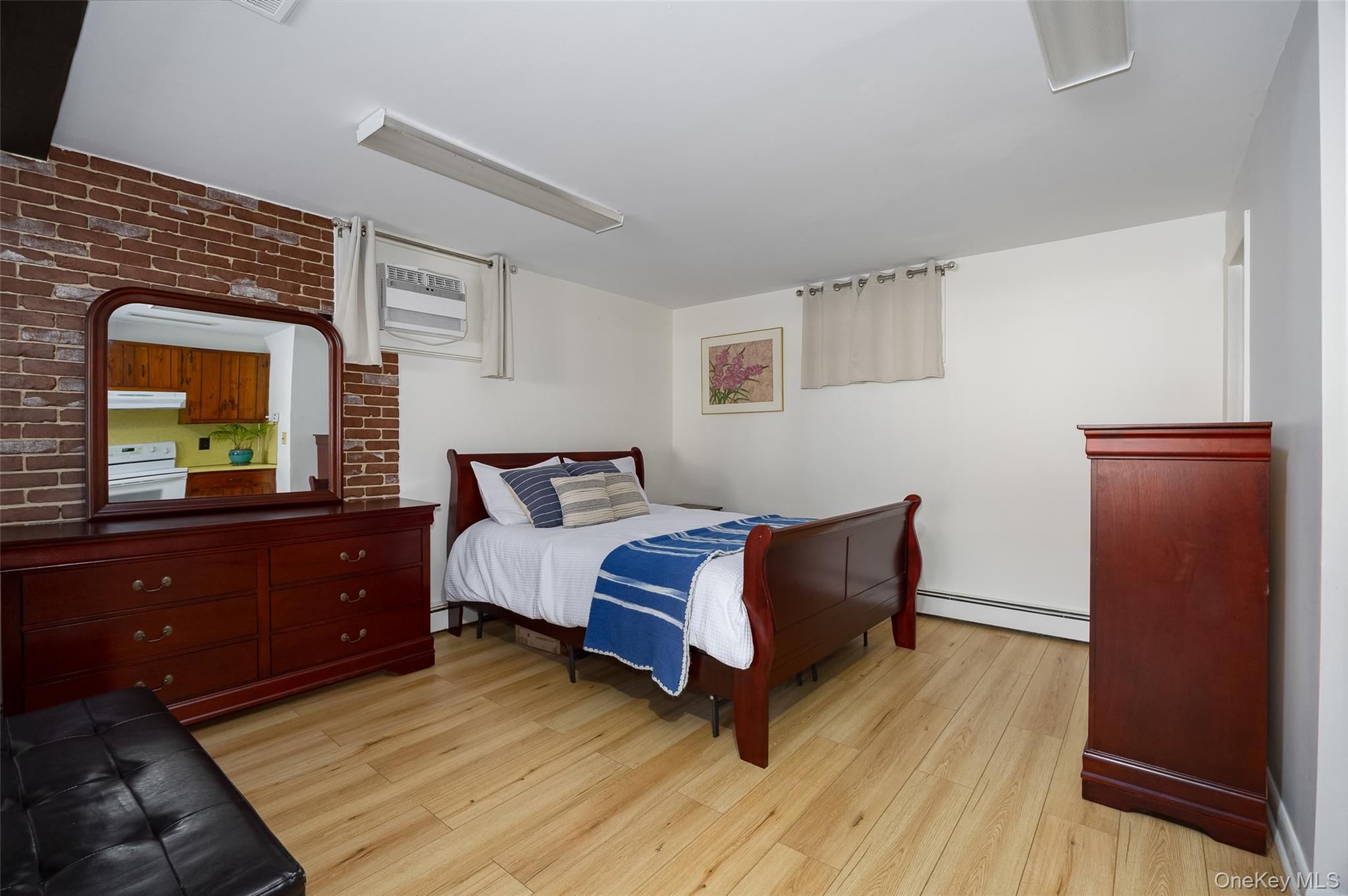 563 Spring Lake Road Red Hook, NY 12571 - Photo 15 of 33 a bedroom with a bed and a dresser