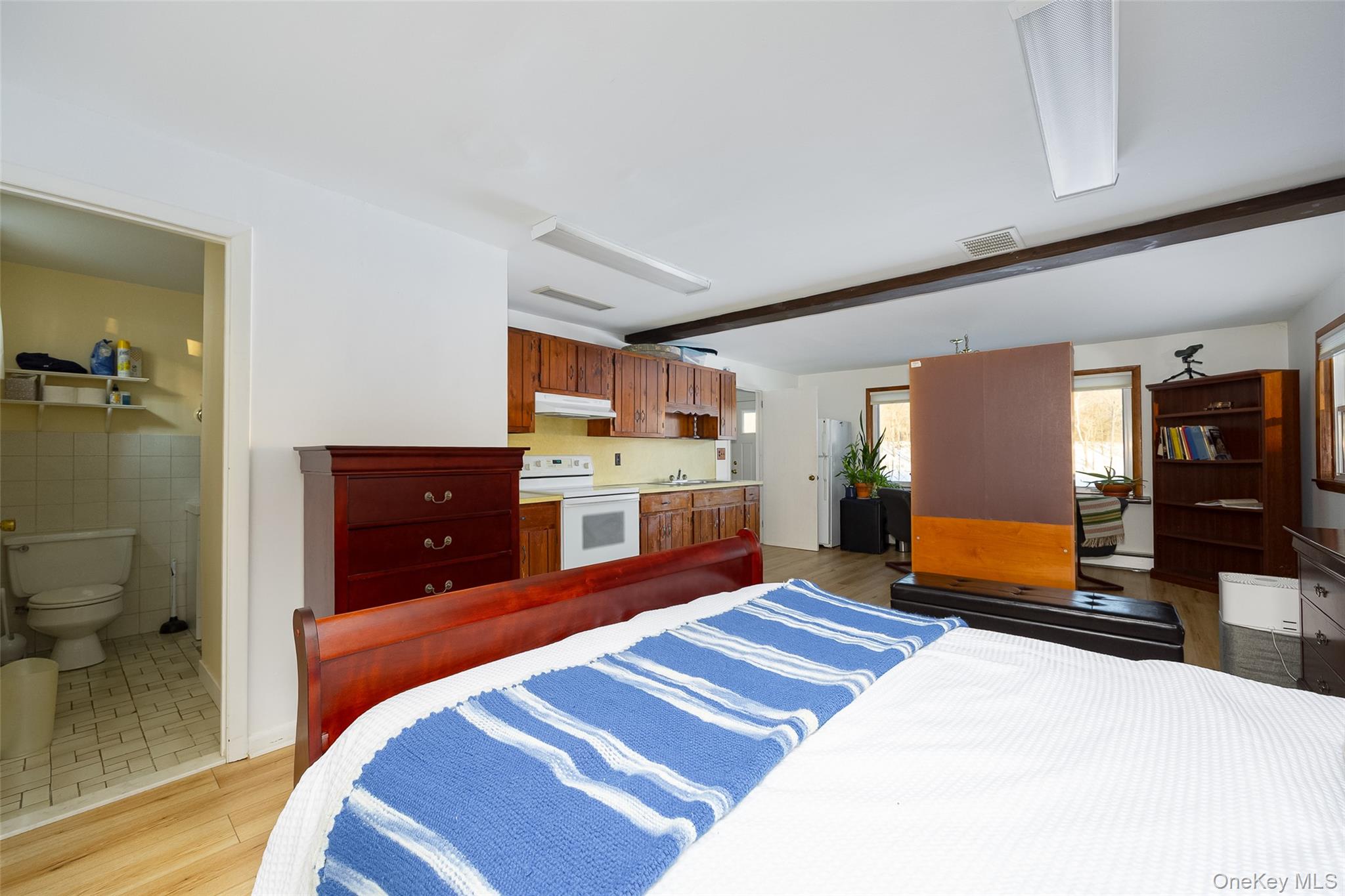 563 Spring Lake Road Red Hook, NY 12571 - Photo 16 of 33 a bedroom with a bed and a couch