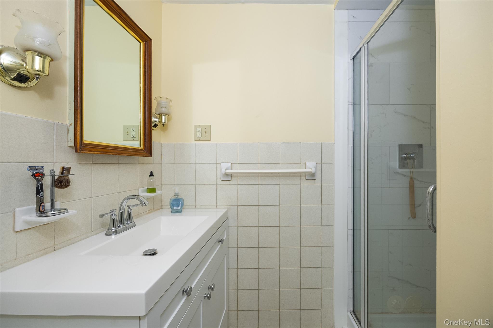 563 Spring Lake Road Red Hook, NY 12571 - Photo 17 of 33 a bathroom with a sink and a mirror