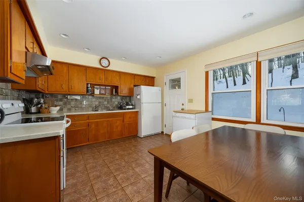a kitchen with stainless steel appliances granite countertop a sink and cabinets