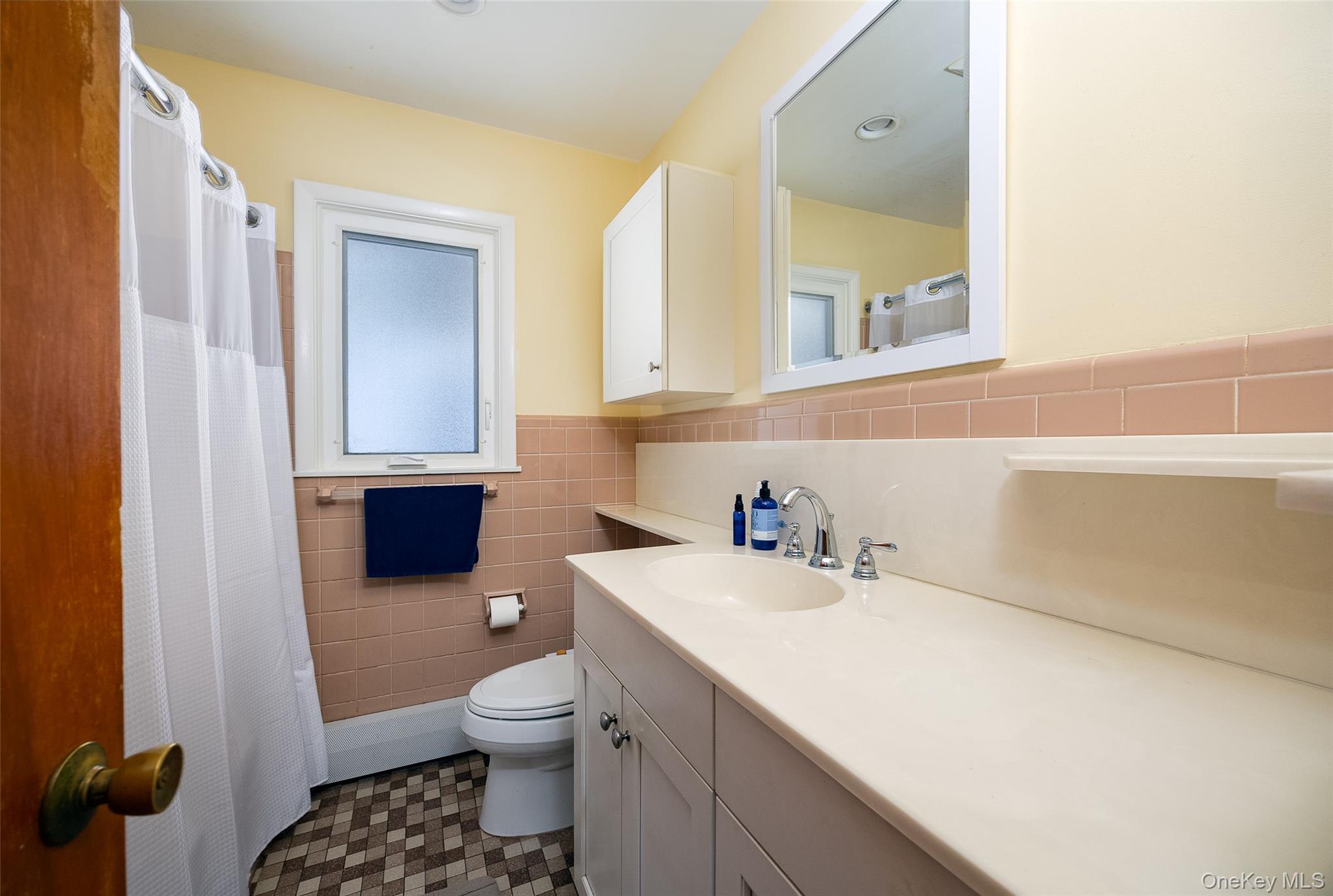 563 Spring Lake Road Red Hook, NY 12571 - Photo 10 of 33 a bathroom with a sink toilet vanity and tub