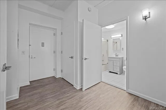 wooden floor with white walls