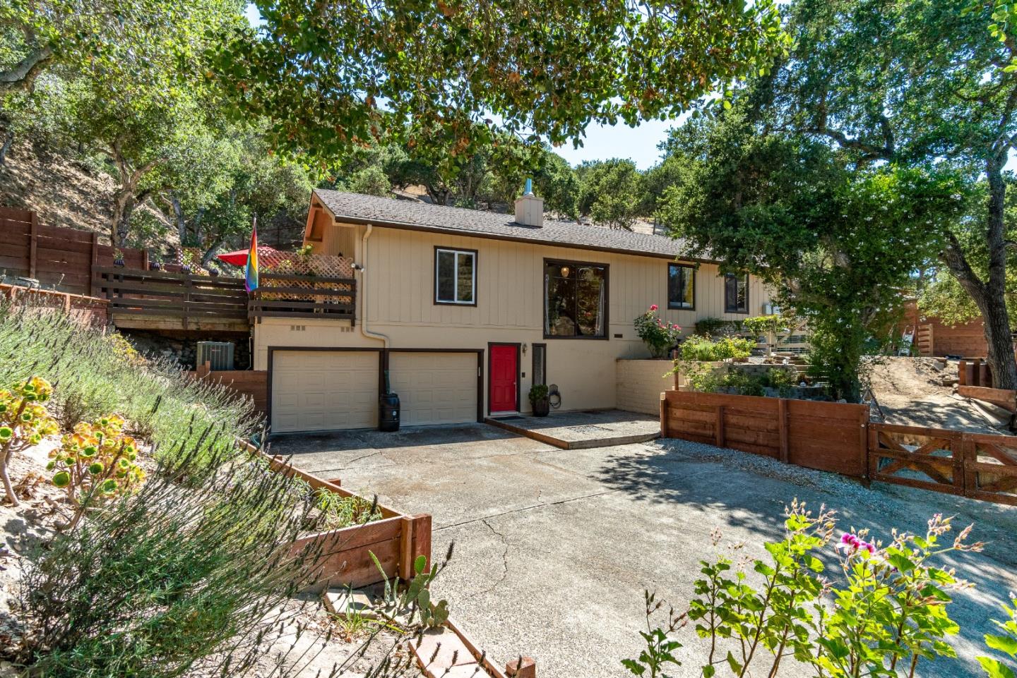 a view of a house with backyard and sitting area
