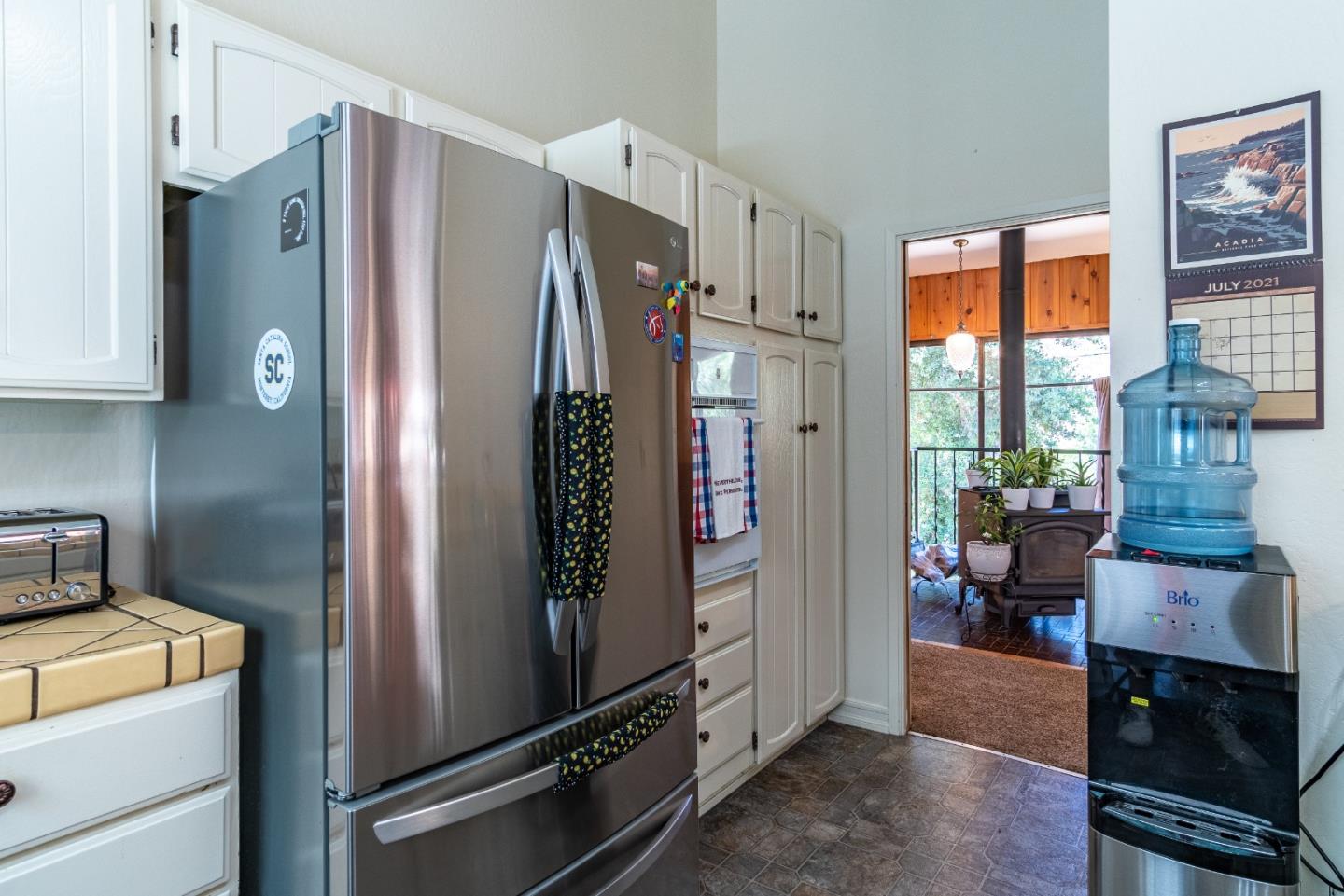 161 San Benancio Road Salinas, CA 93908 - Photo 12 of 44 a view of a kitchen with fridge and wooden floor