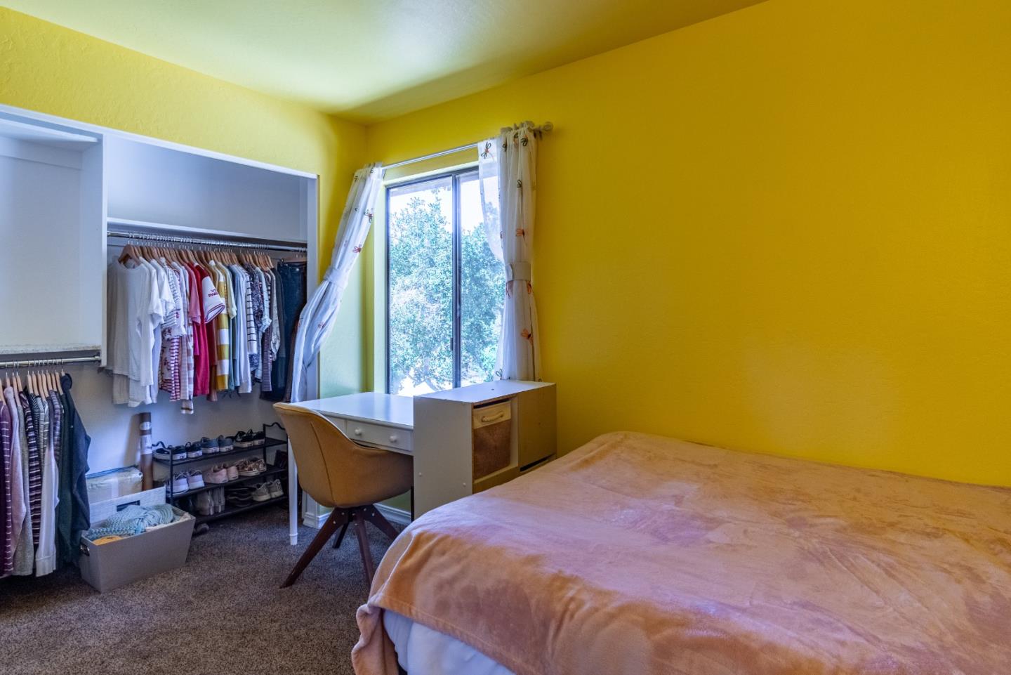161 San Benancio Road Salinas, CA 93908 - Photo 15 of 44 a bedroom with a bed and a window