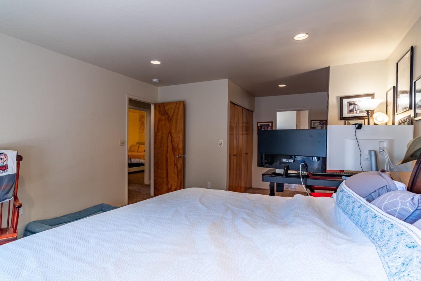 161 San Benancio Road Salinas, CA 93908 - Photo 18 of 44 a bedroom with furniture and a flat screen tv