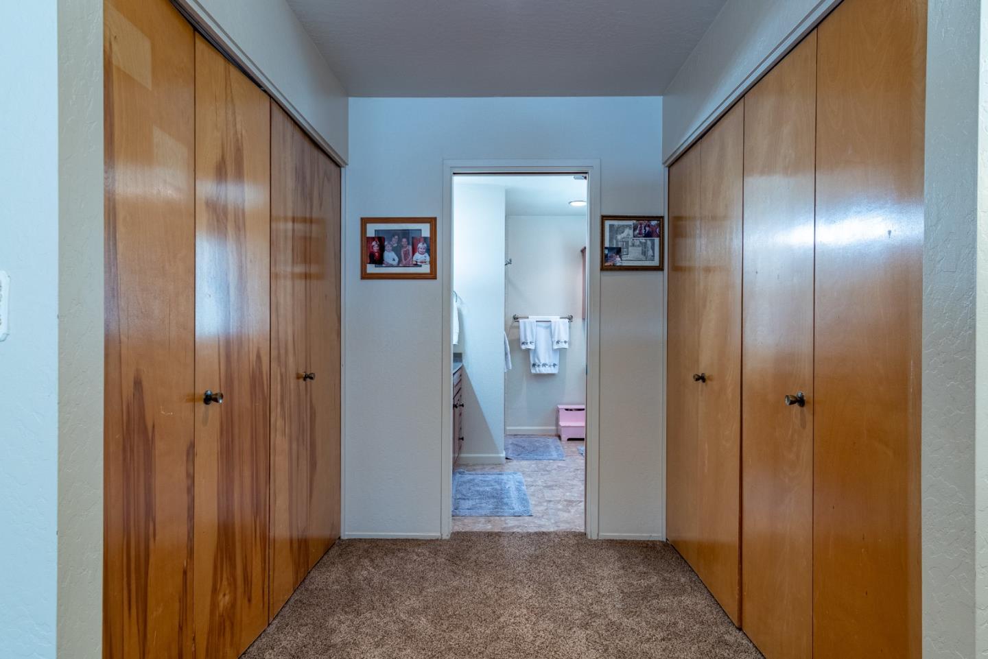161 San Benancio Road Salinas, CA 93908 - Photo 19 of 44 a view of a hallway with wooden floor and a bathroom