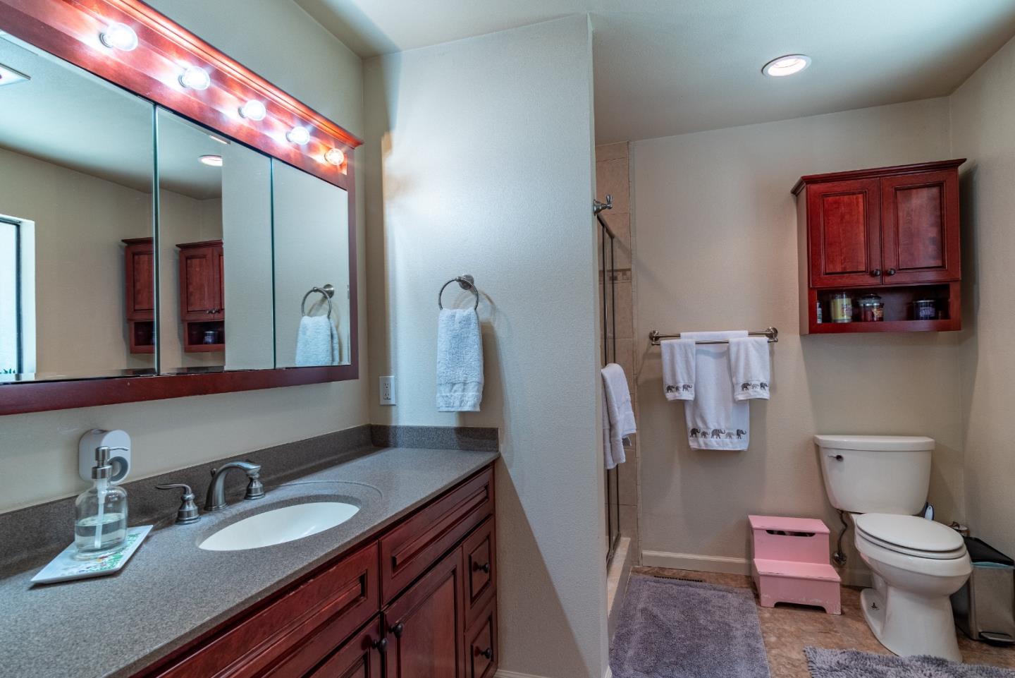 161 San Benancio Road Salinas, CA 93908 - Photo 20 of 44 a bathroom with a granite countertop toilet sink and mirror