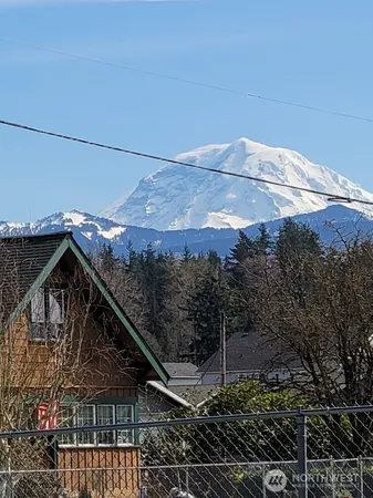a view of a roof deck with wooden fence
