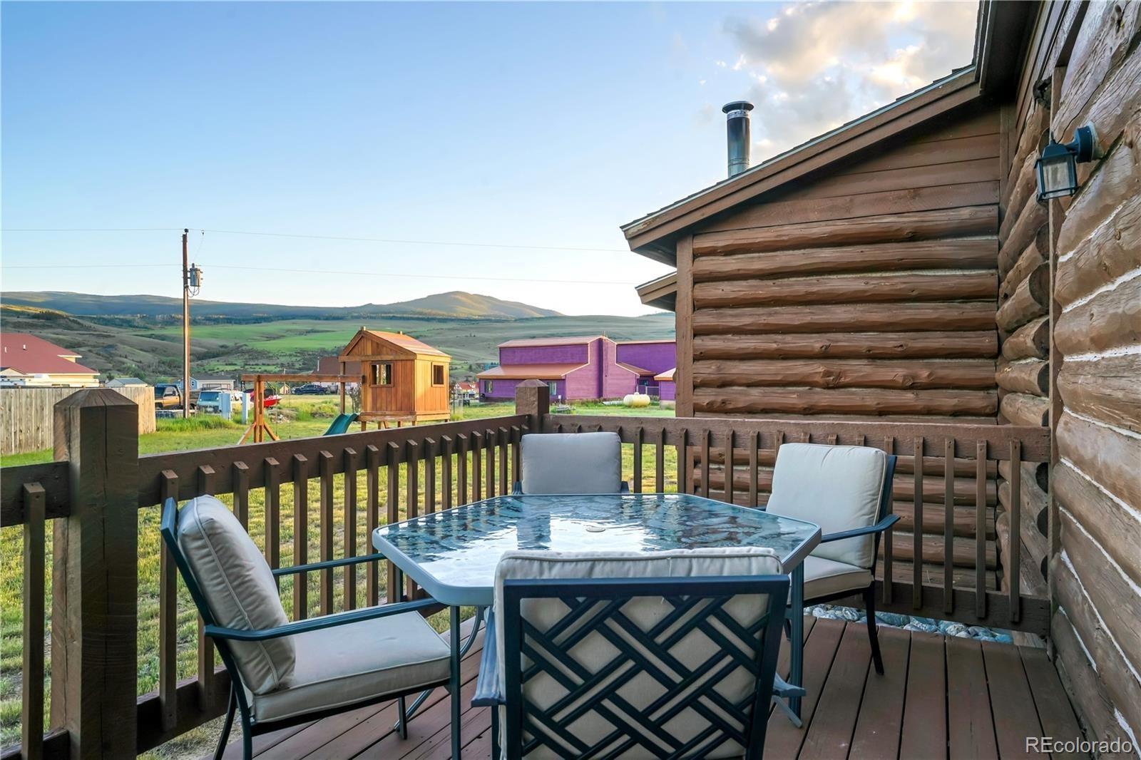 115 County Road 1014 Silverthorne, CO 80498 - Photo 6 of 20 a view of a chairs and table on the deck