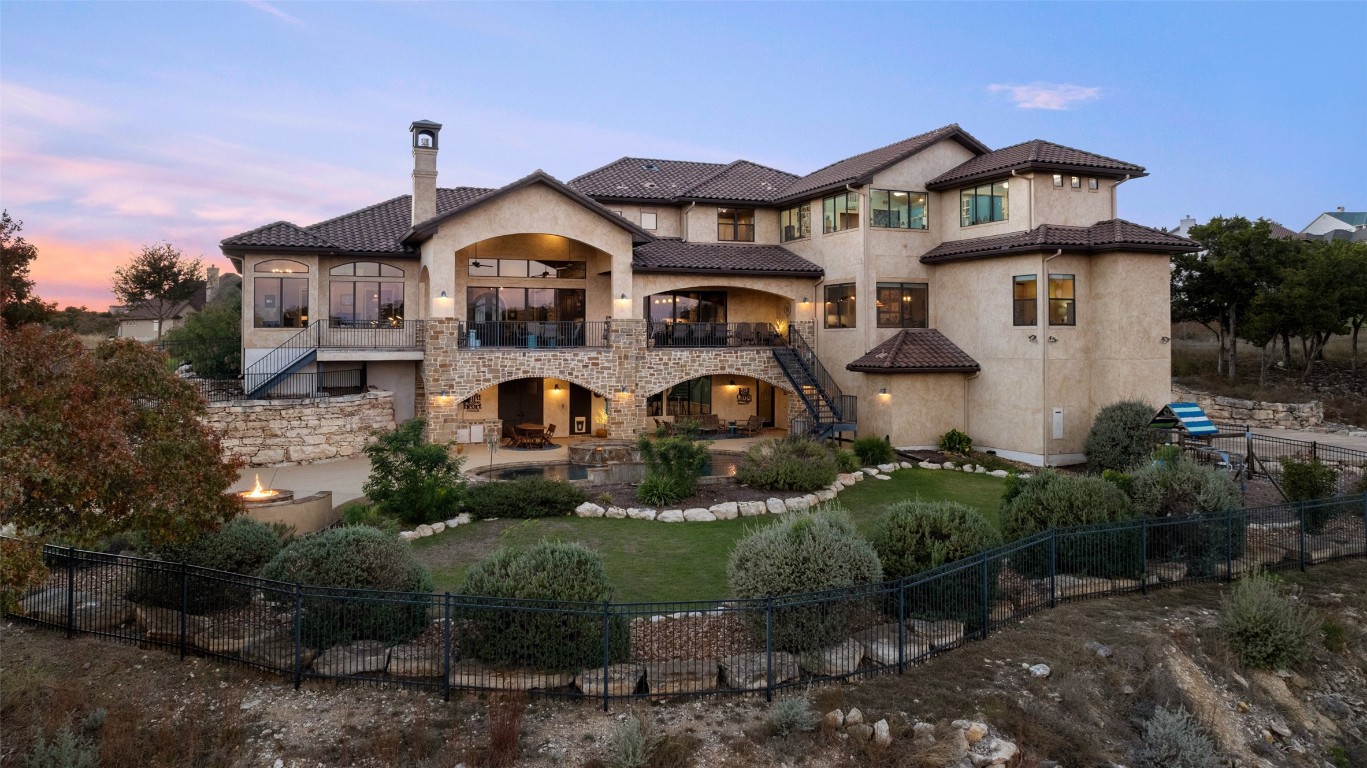1039 Bluewater Place Spring Branch, TX 78070 - Photo 1 of 40 a front view of a house with garden