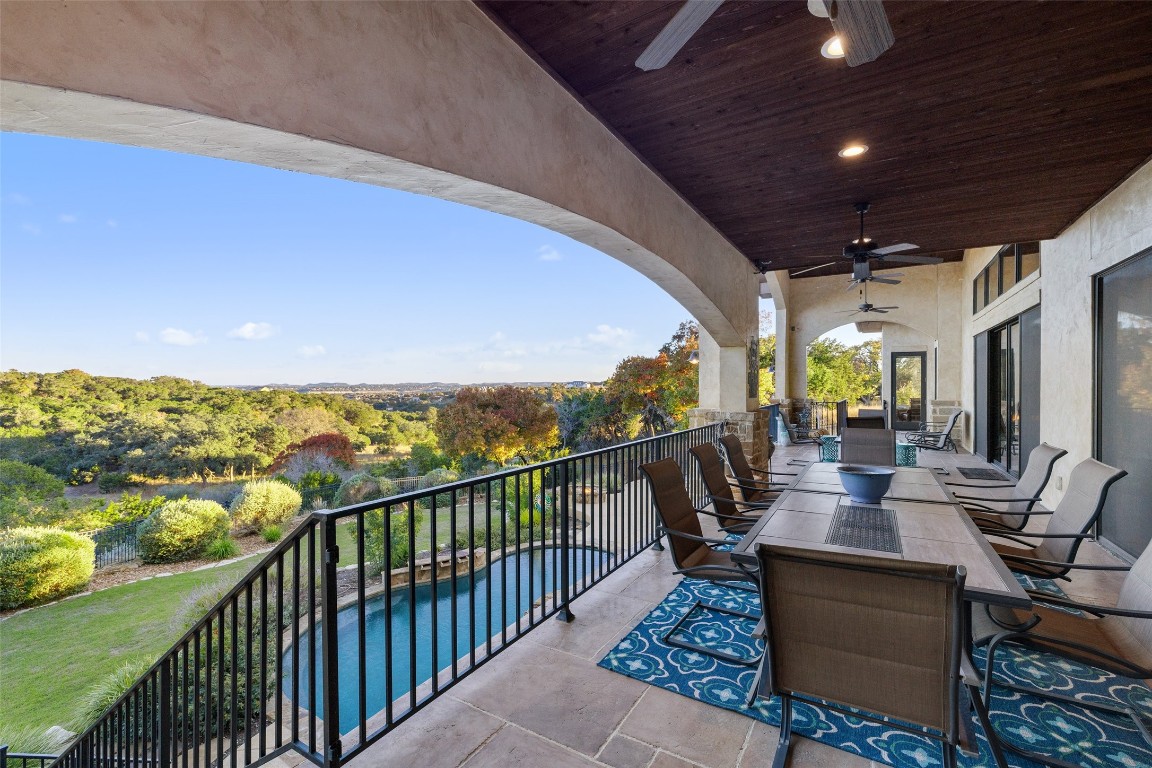 1039 Bluewater Place Spring Branch, TX 78070 - Photo 11 of 40 a view of a balcony with chairs and wooden floor