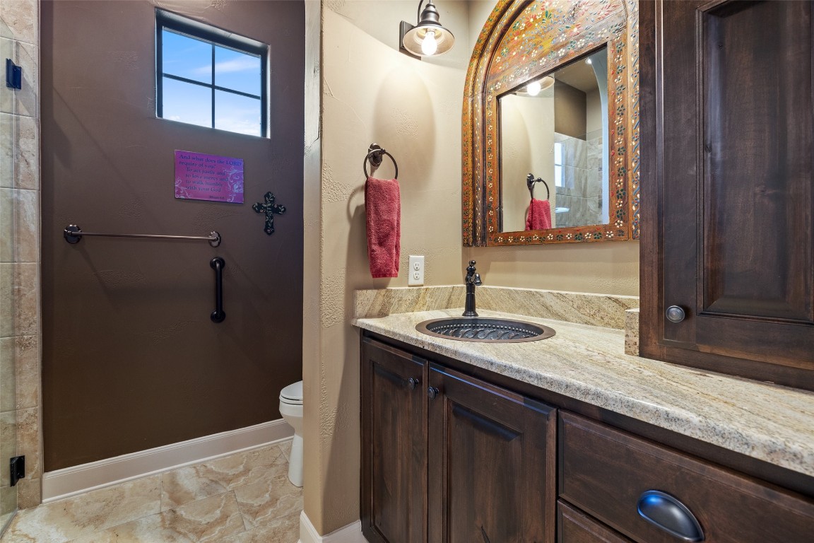 1039 Bluewater Place Spring Branch, TX 78070 - Photo 23 of 40 a bathroom with a granite countertop shower a sink and a mirror