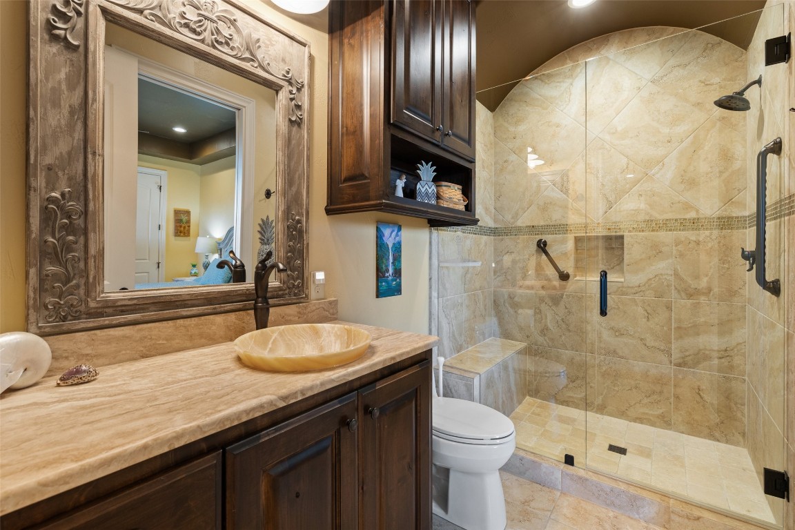 1039 Bluewater Place Spring Branch, TX 78070 - Photo 29 of 40 a bathroom with a granite countertop sink toilet and shower