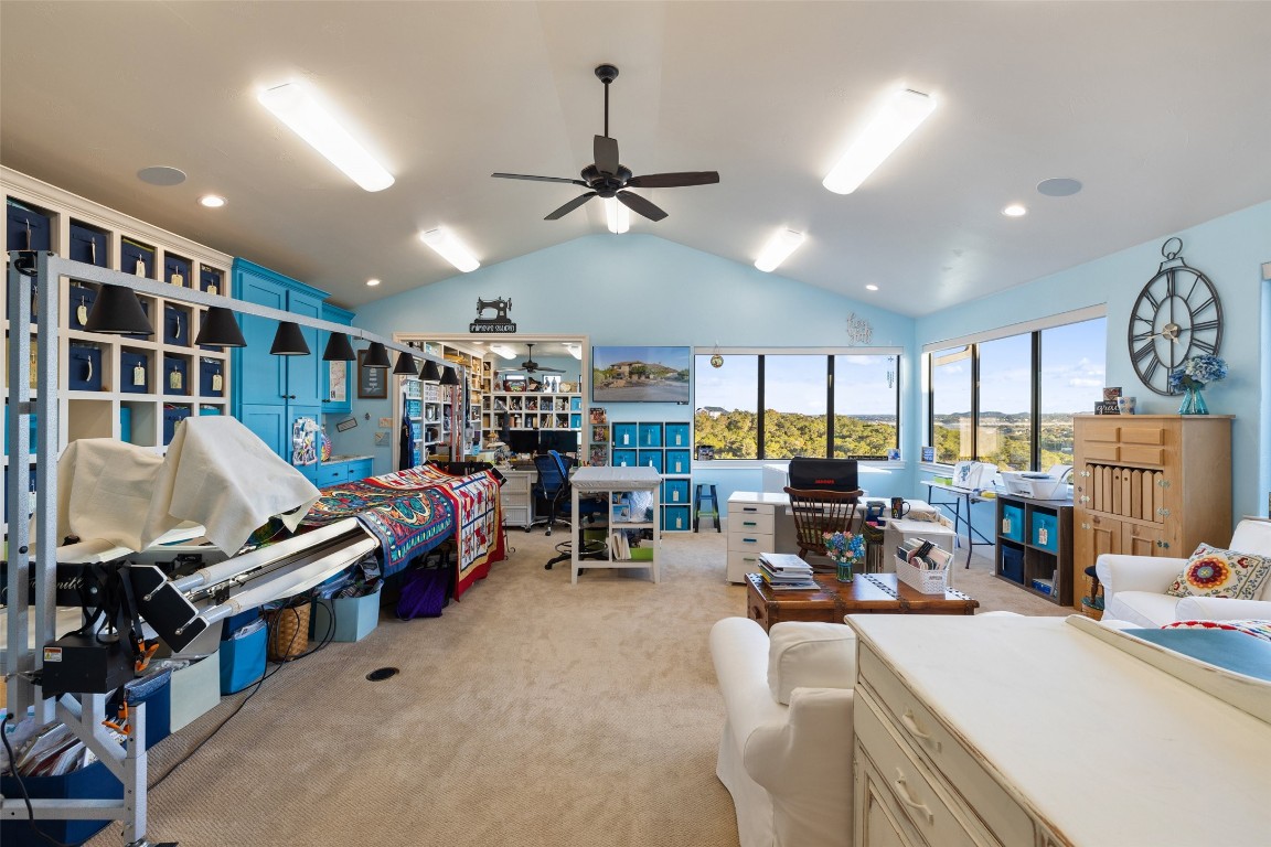 1039 Bluewater Place Spring Branch, TX 78070 - Photo 31 of 40 a living room with furniture a fireplace and a flat screen tv