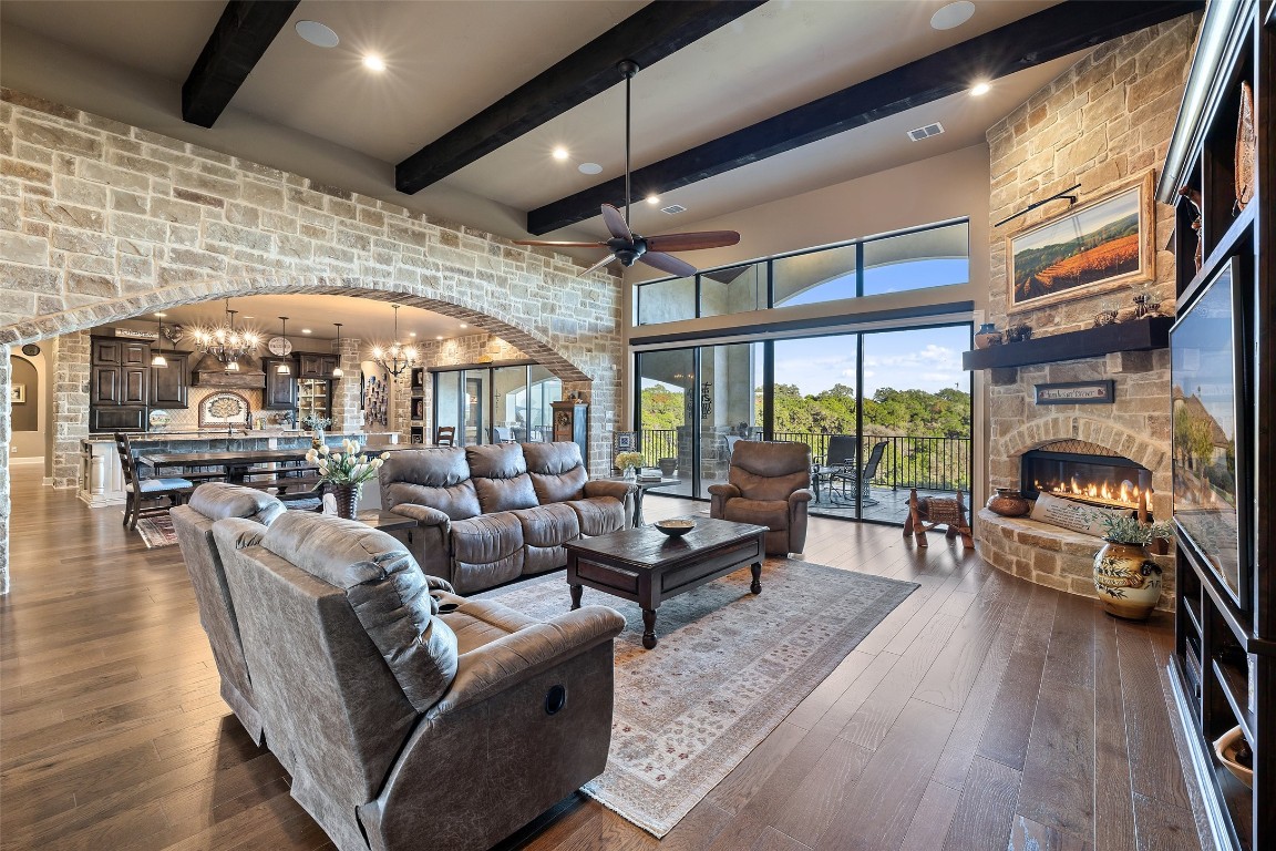 1039 Bluewater Place Spring Branch, TX 78070 - Photo 9 of 40 a dining room with furniture a fireplace and wooden floor