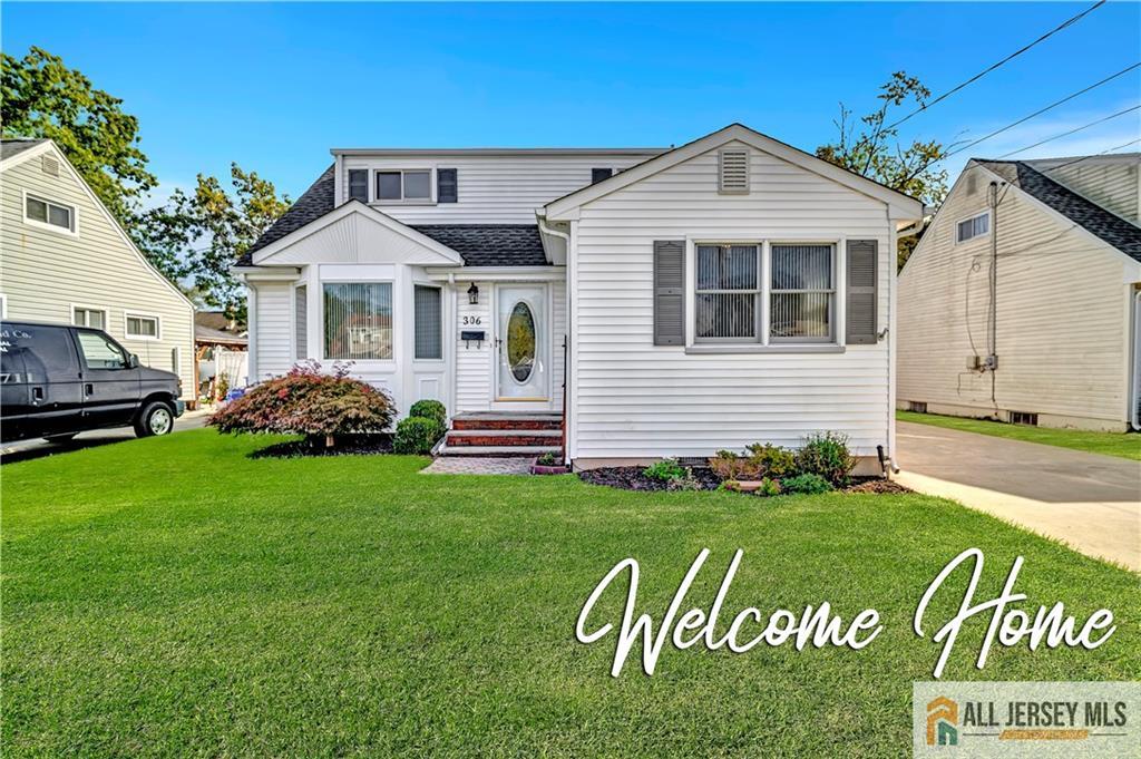 306 Austin Avenue Old Bridge, NJ 08857 - Photo 1 of 39 a front view of a house with a yard