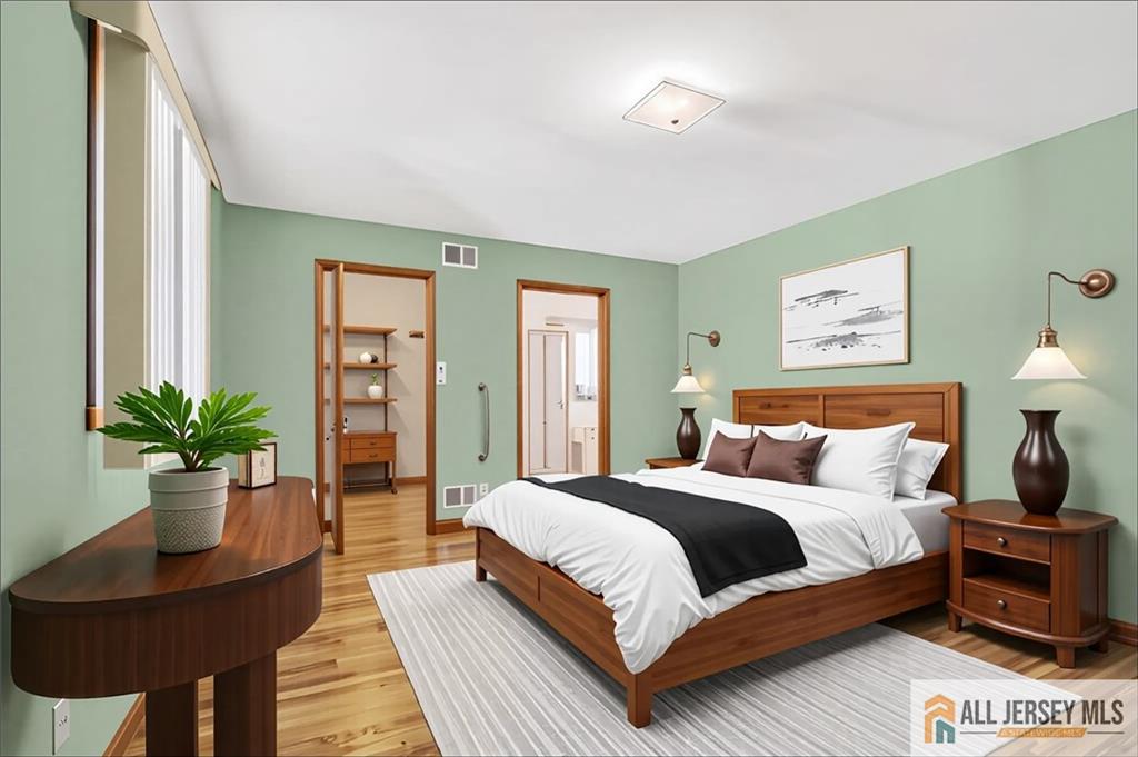 306 Austin Avenue Old Bridge, NJ 08857 - Photo 21 of 39 a bedroom with a large bed and a potted plant