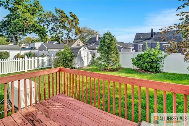 a view of a tree in front of a small yard