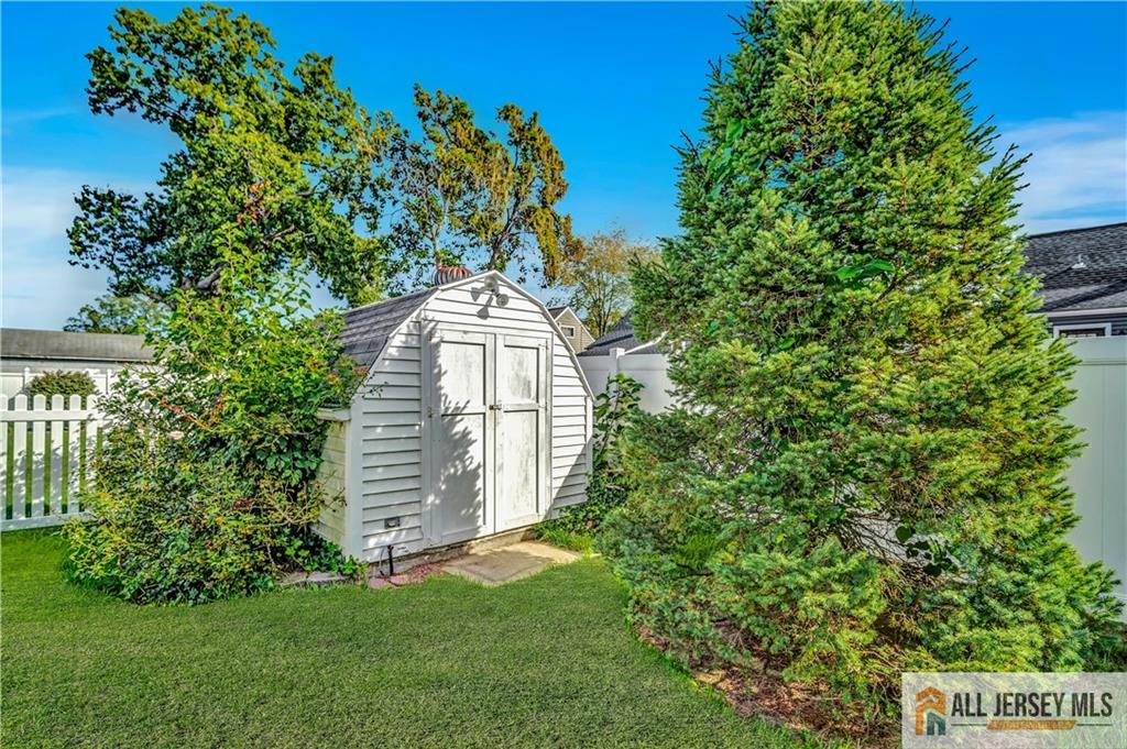 306 Austin Avenue Old Bridge, NJ 08857 - Photo 39 of 39 a view of a tree in front of a small yard