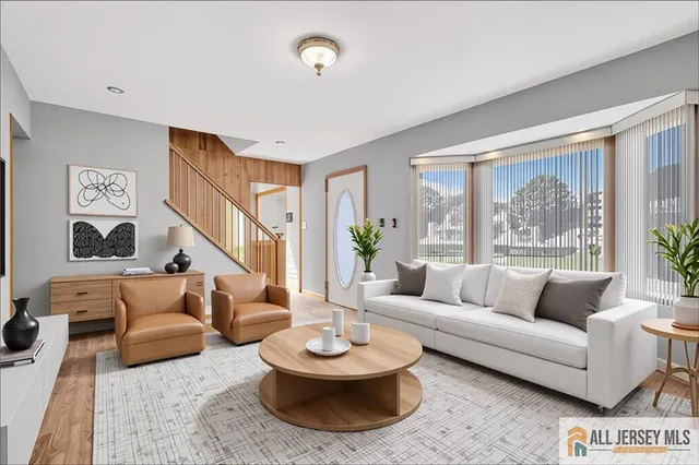 a living room with furniture and a large window