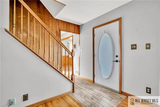 a view of an entryway with wooden floor