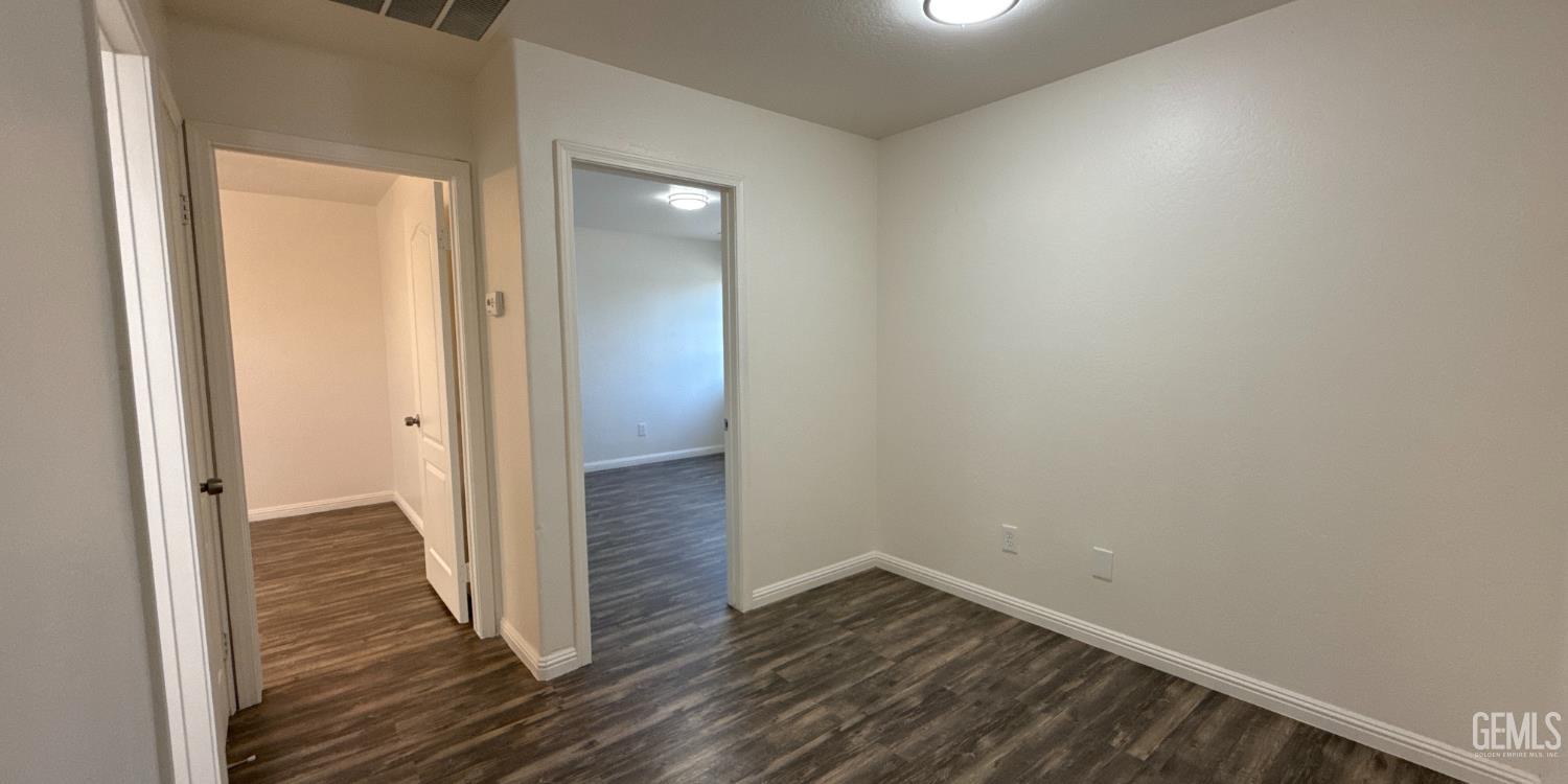 Undisclosed Address Bakersfield, CA 93312 - Photo 14 of 20 a view of a hallway with wooden floor