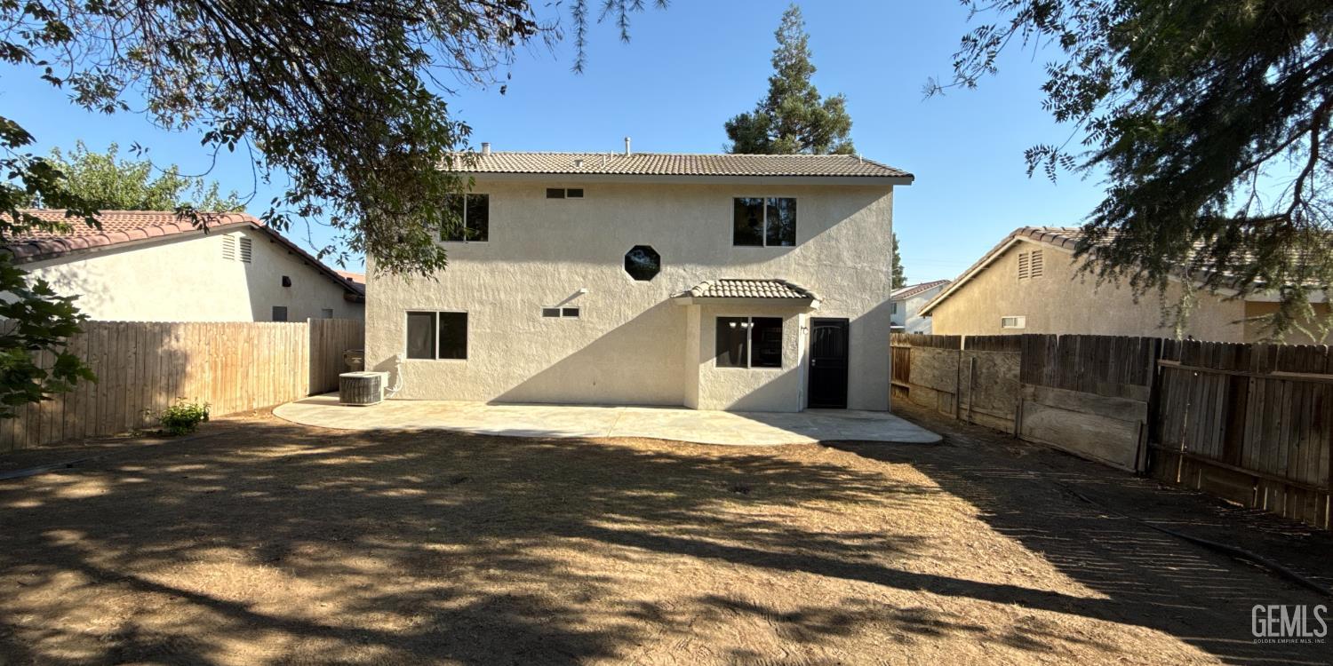 Undisclosed Address Bakersfield, CA 93312 - Photo 20 of 20 a view of a white house with a yard