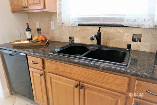 1516 Mayo Street Ridgecrest, CA 93555 - Photo 12 of 33 a kitchen with a sink and cabinets