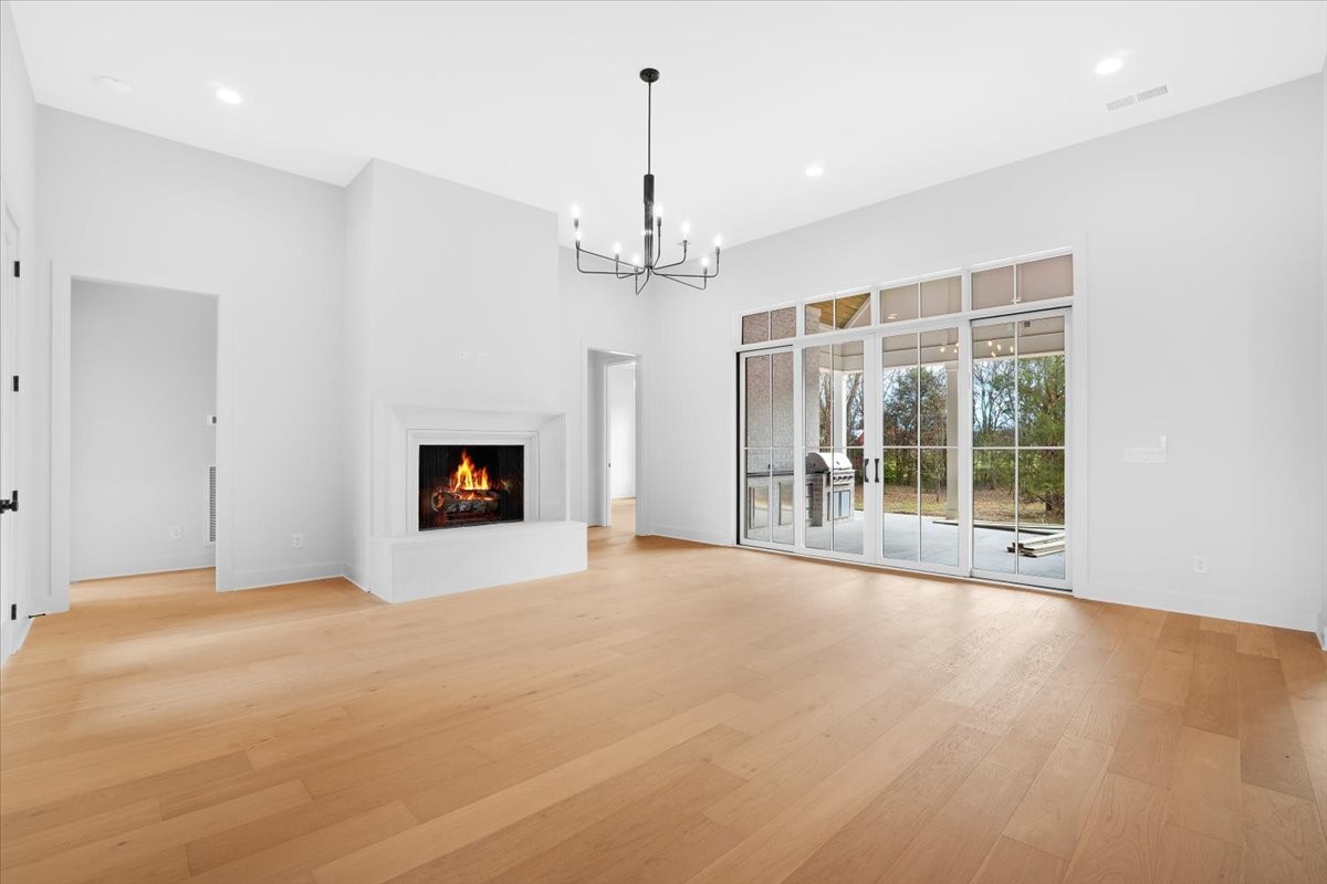 2412 Joe Brown Road Spring Hill, TN 37174 - Photo 18 of 86 a view of an empty room with a fireplace and a window