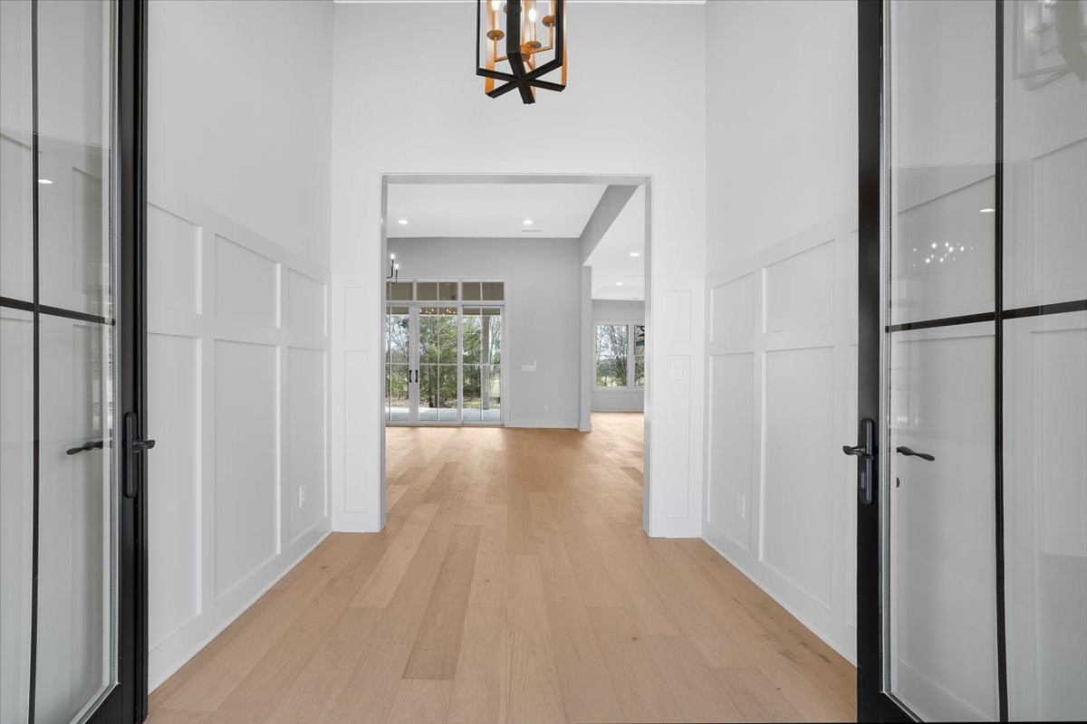 2412 Joe Brown Road Spring Hill, TN 37174 - Photo 2 of 86 a view of a hallway with wooden floor and a living room