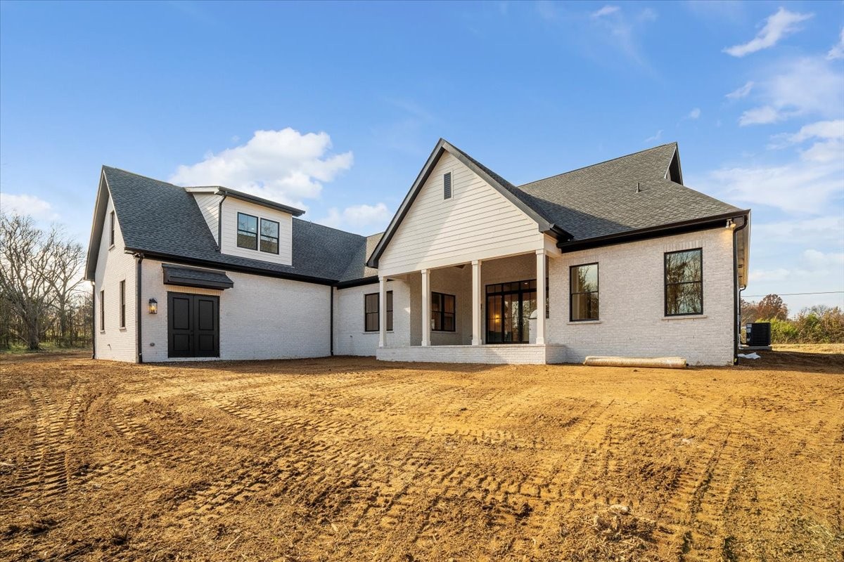 2412 Joe Brown Road Spring Hill, TN 37174 - Photo 30 of 86 a front view of house with yard and trees in the background